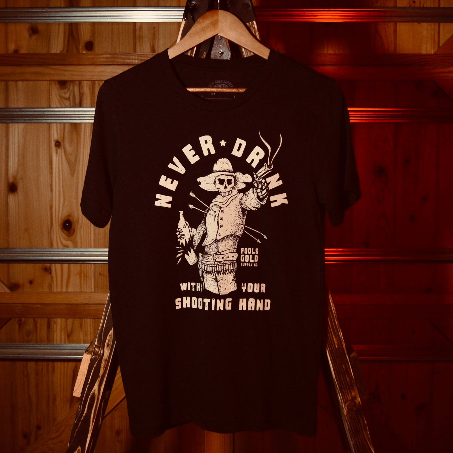 Never Shoot With Your Shooting Hand T-Shirt - Front Graphic